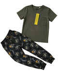 Green t-shirt and patterned pants on a light background