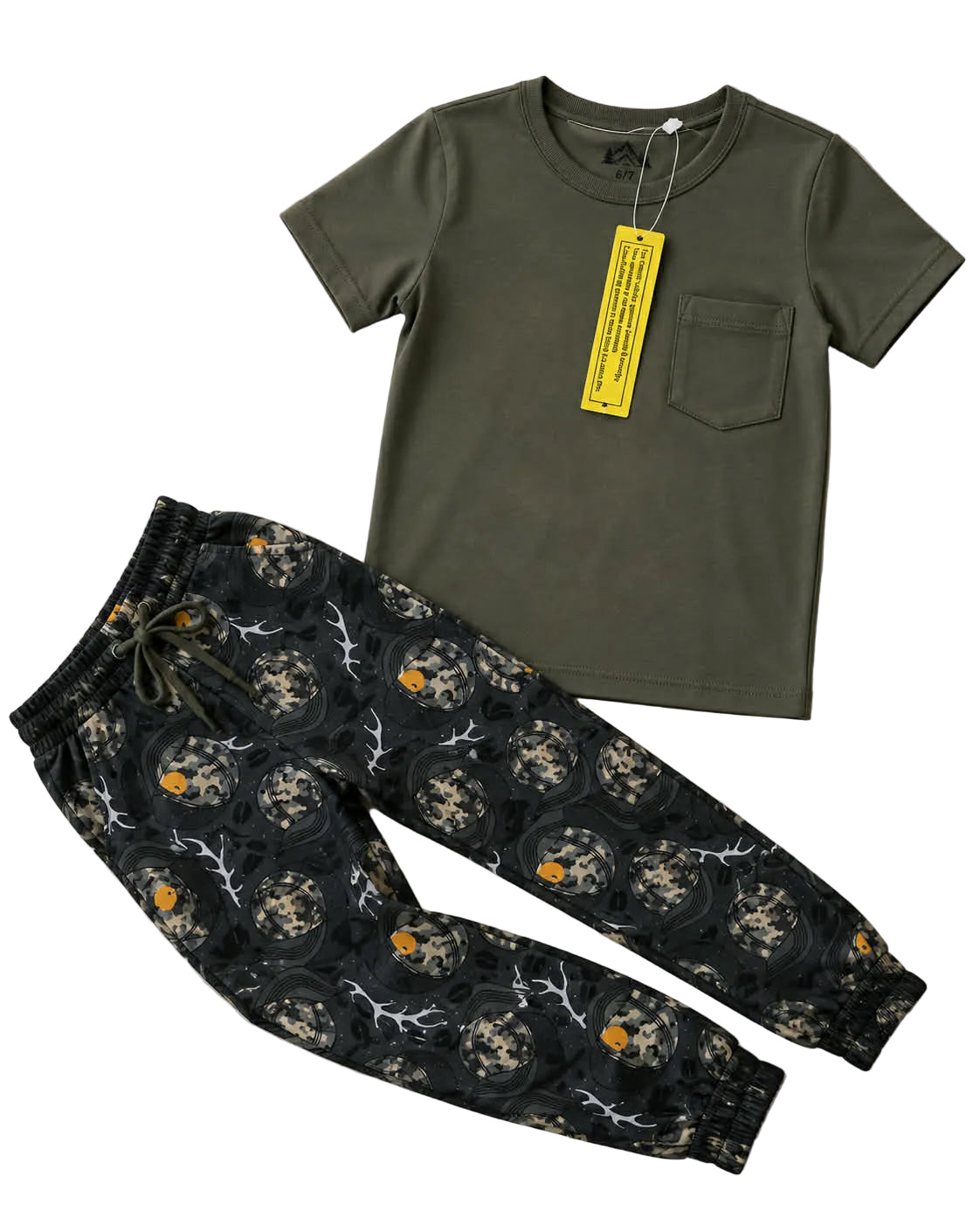 Green t-shirt and patterned pants on a light background