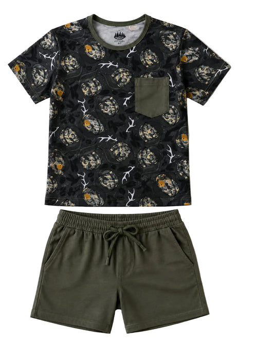 Black t-shirt with skull and antler pattern and green shorts on a light gray background