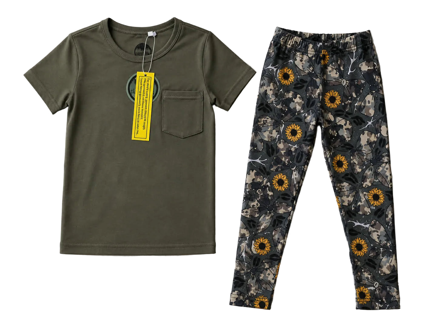 Green t-shirt with a pocket and floral-patterned pants on a light gray background. Exclusive collaboration with Comfy Panda Co. 