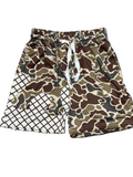 Camouflage patterned shorts with a checkered section on a gray surface